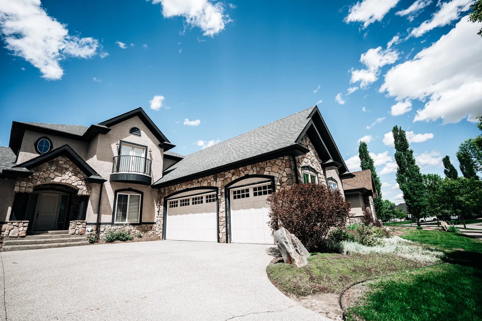 Large Calgary home with a new dark grey shingle roof