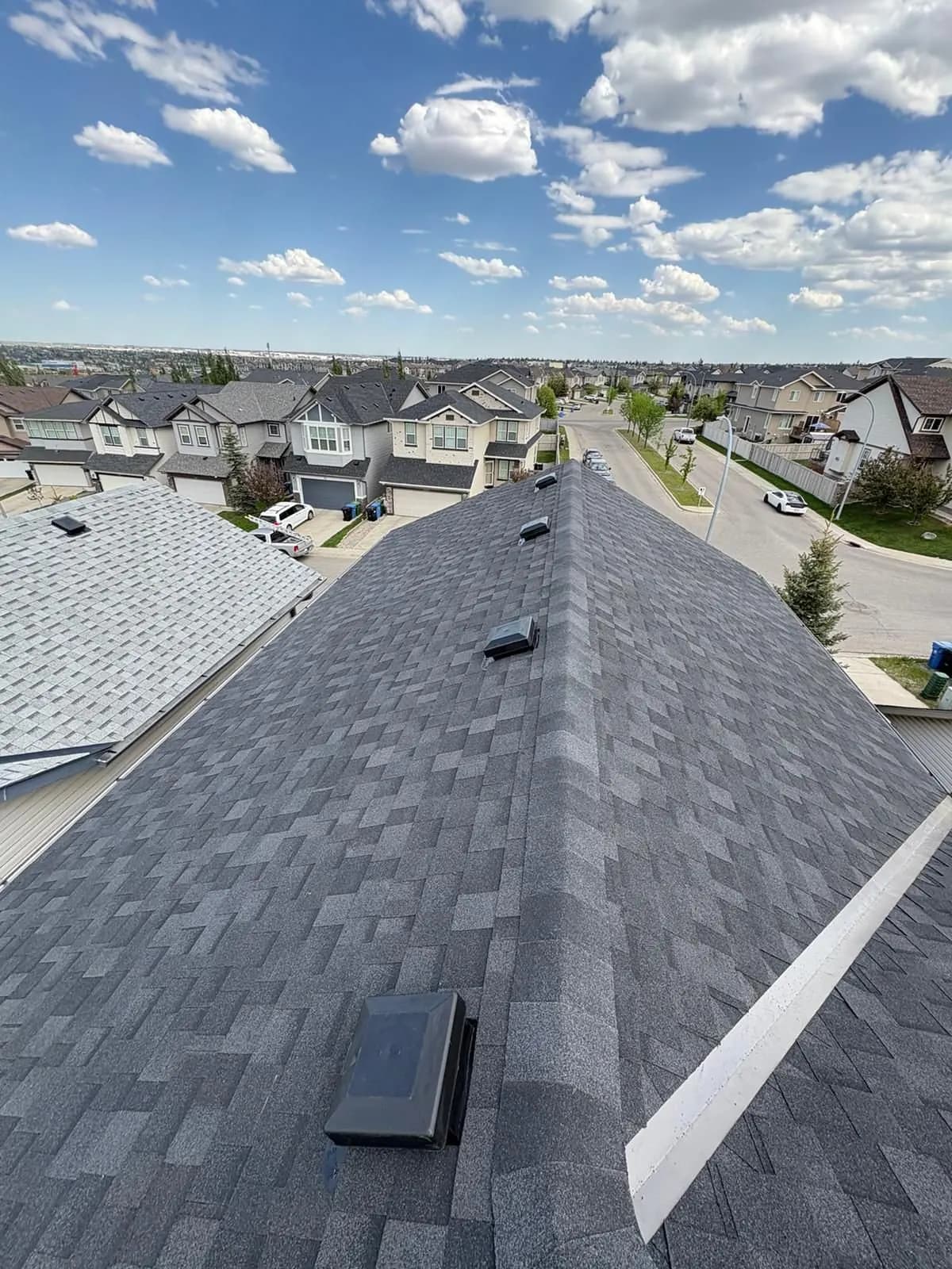 Finished ridge with a Calgary neighbourhood in the background