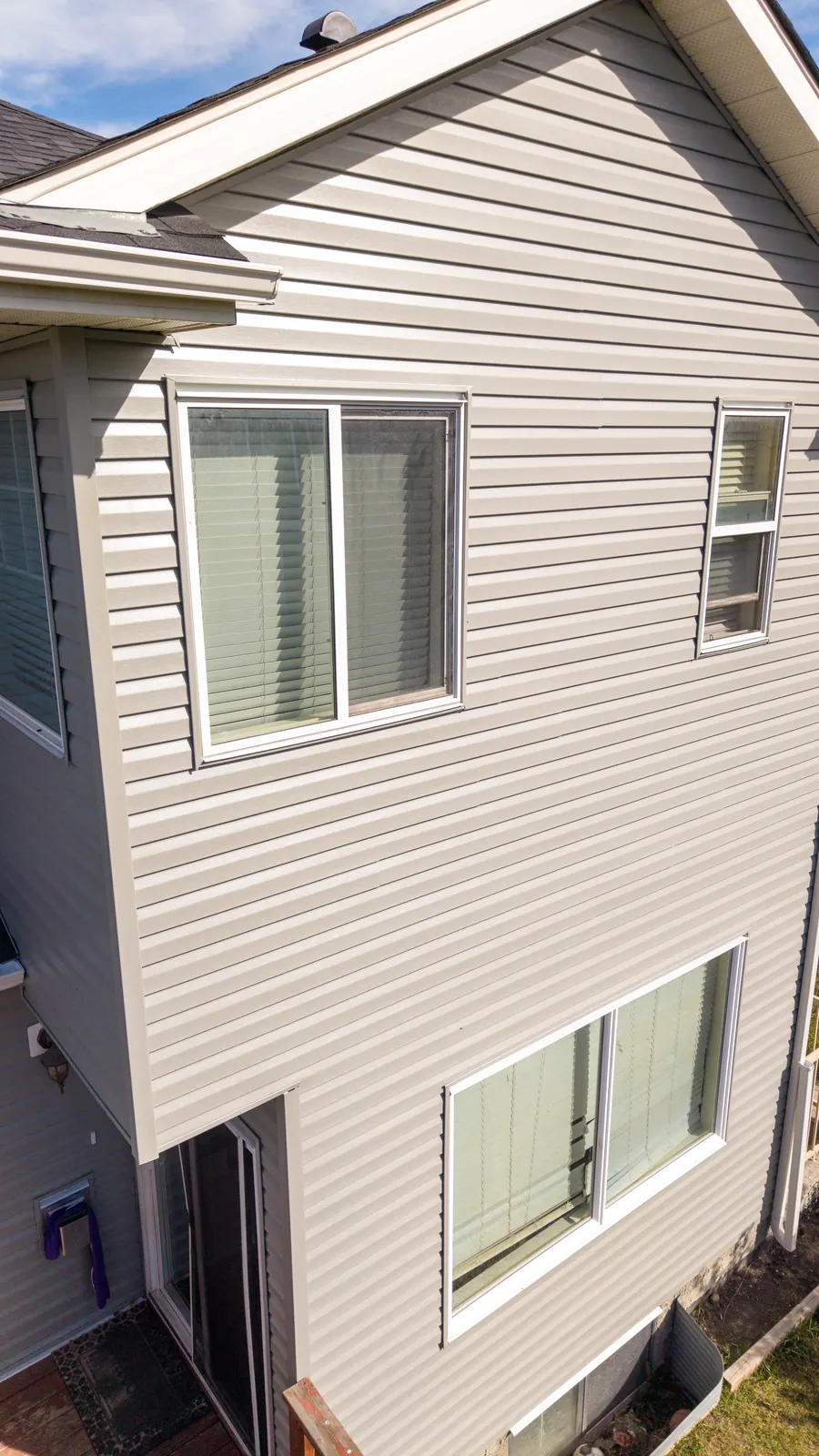 Finished vinyl siding on a two-storey Calgary home