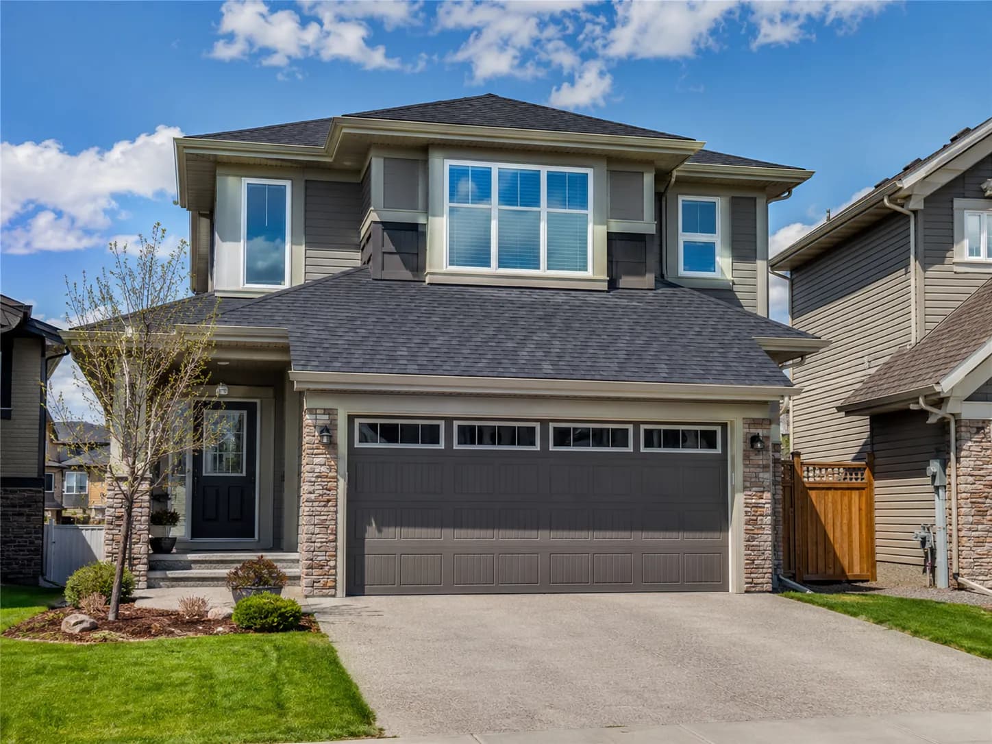Modern two-storey Calgary home with a freshly completed roof by Calgary Roofing Pro