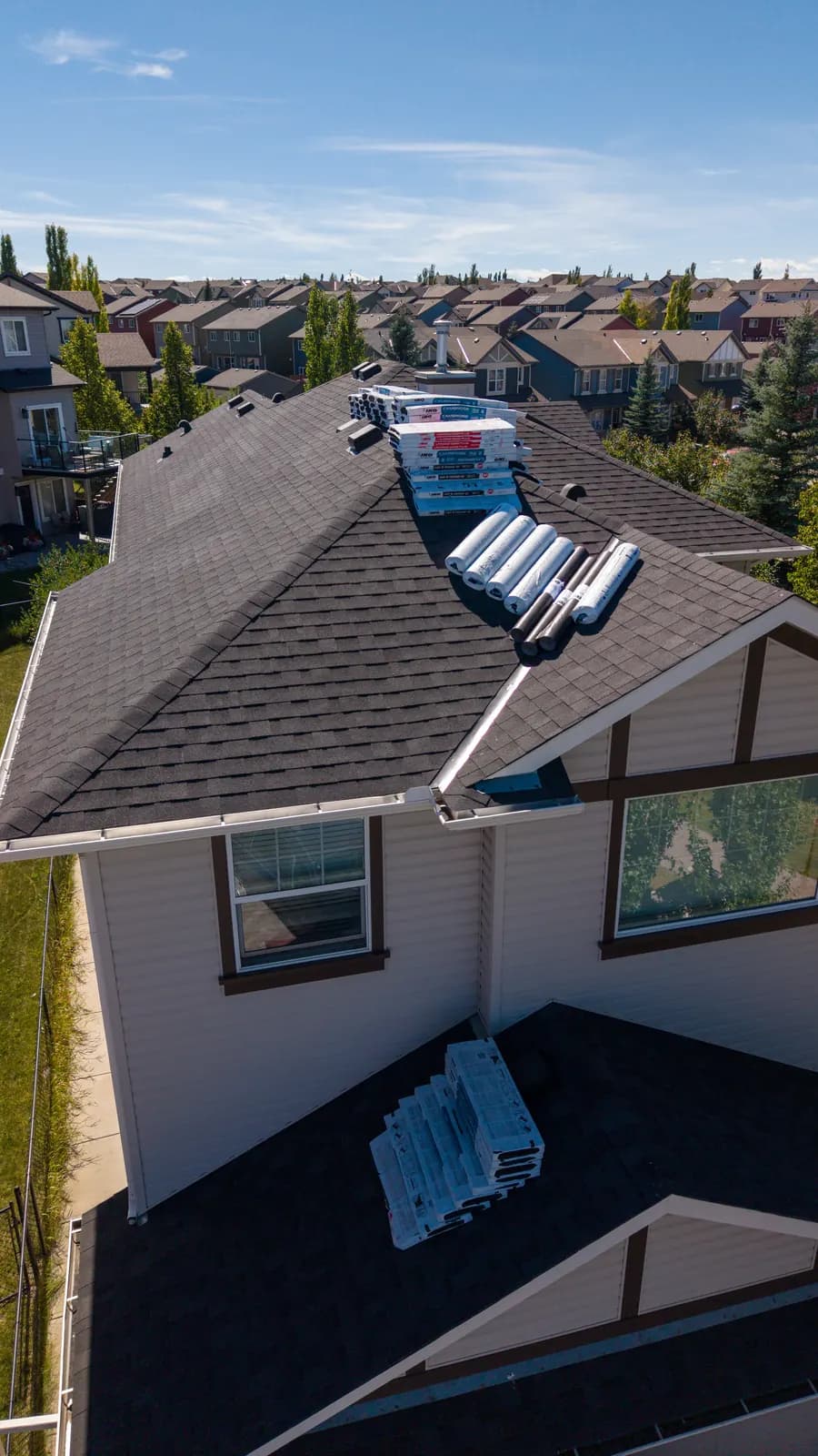 Bundles of new shingles loaded on a roof before installation