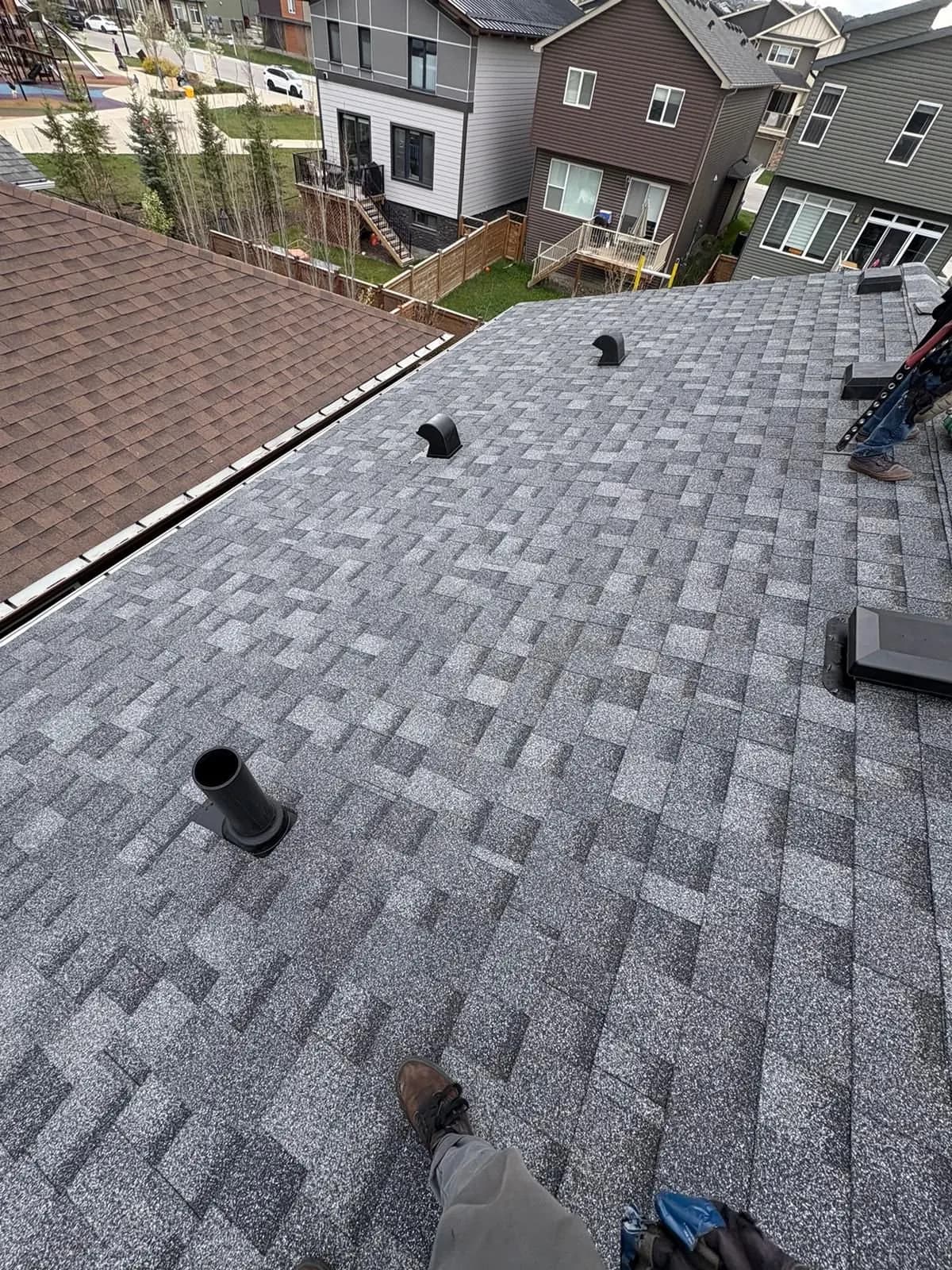 New roof vents installed in fresh shingles