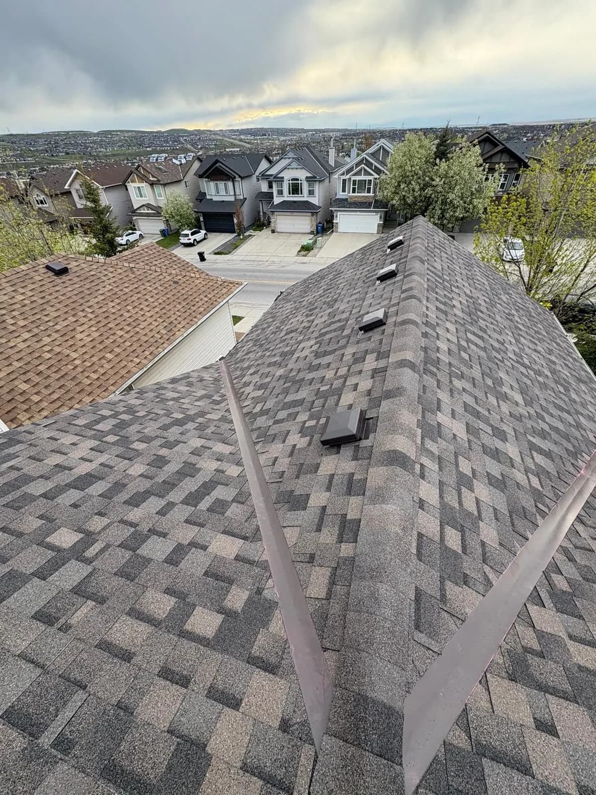 Metal valley flashing on a newly shingled roof